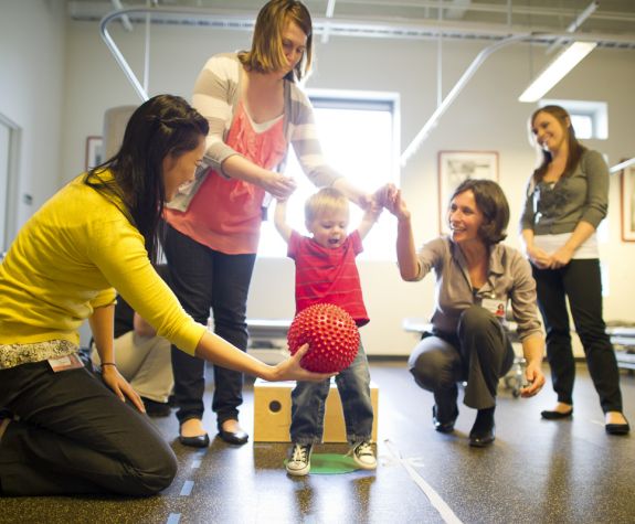 PT students working with child in clinic